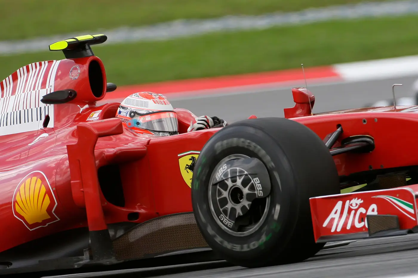 Red Ferrari F1 Car on track